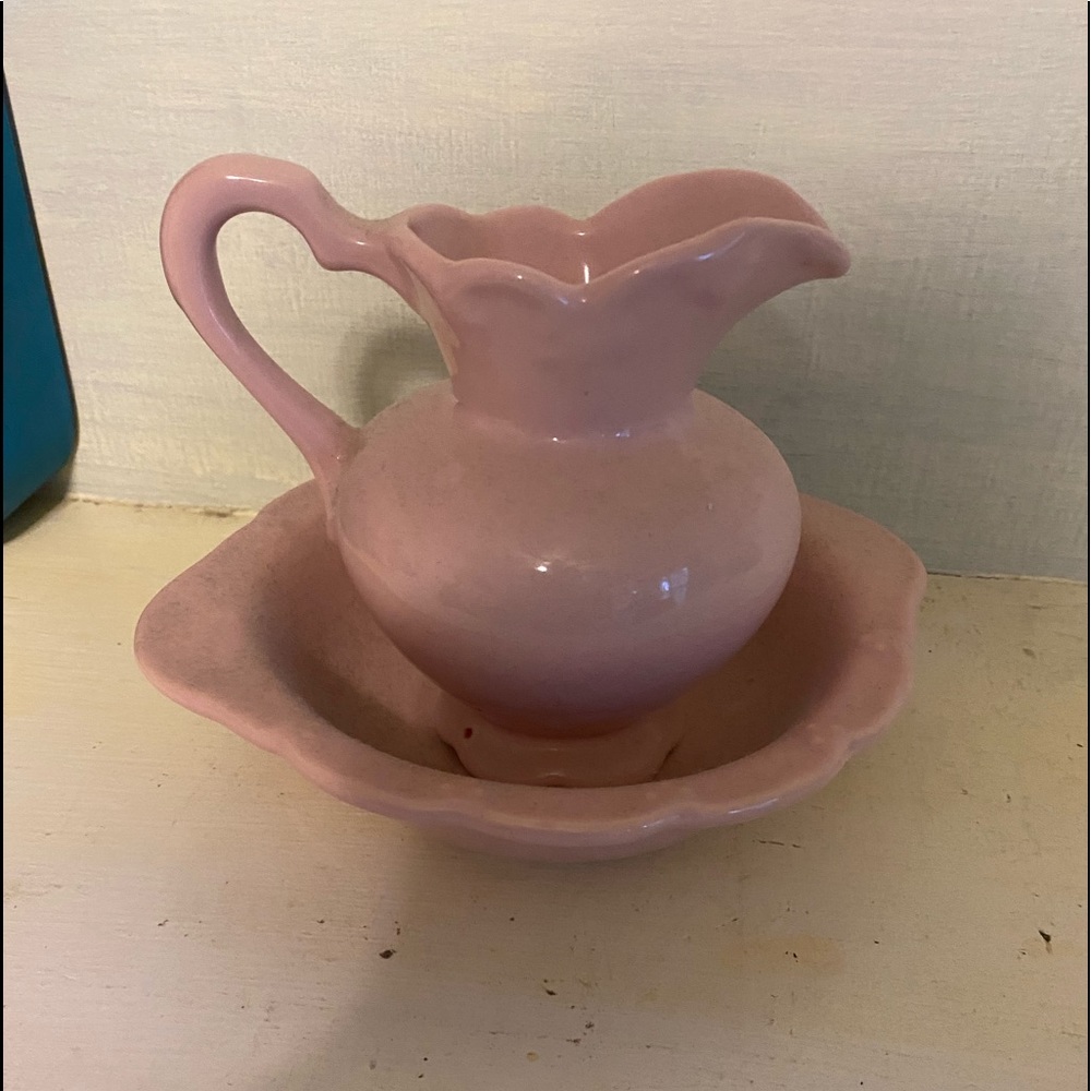 Pink ceramic water pitcher and bowl